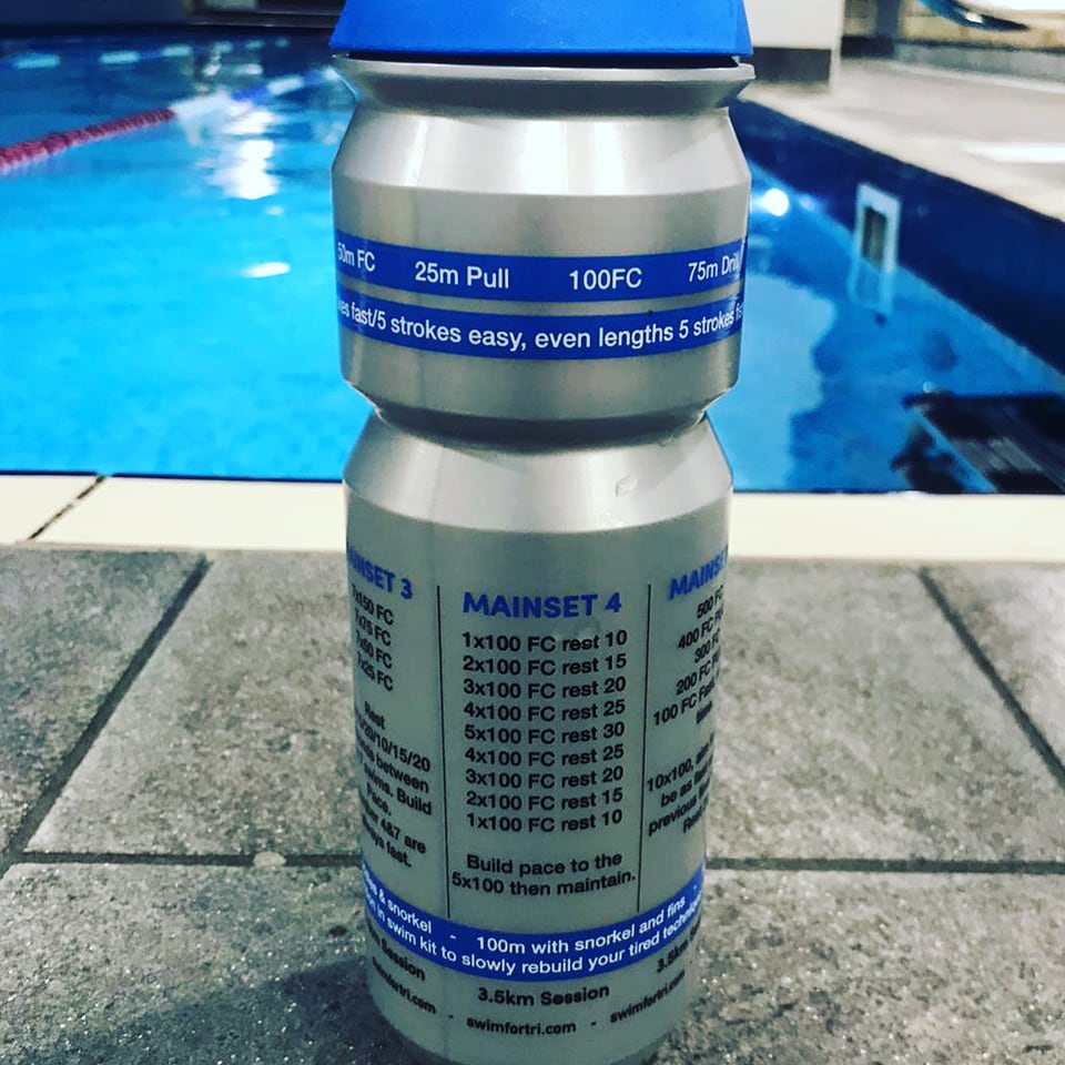 Swim for Tri - Session in a Bottle Training plan water bottle on pool side